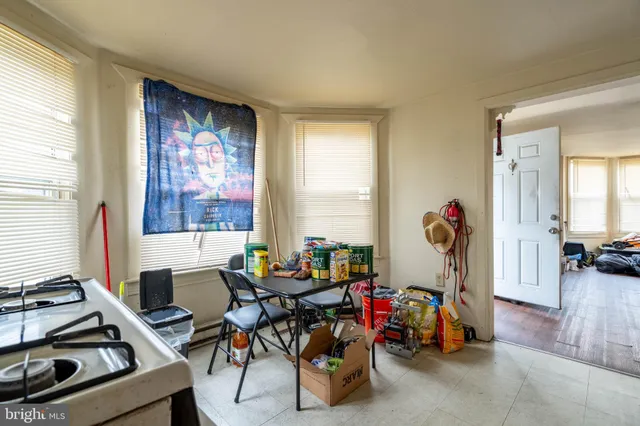 a work room with furniture and a window