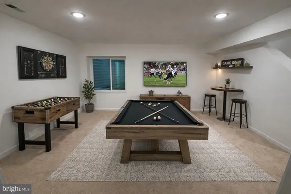 a living room with a couch and piano table