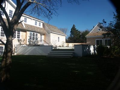 Undisclosed Address Barnstable, MA 02630 - Photo 13 of 13 a front view of a house with a garden