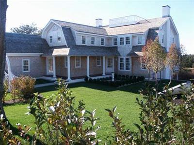 Undisclosed Address Barnstable, MA 02630 - Photo 2 of 13 front view of house with a yard