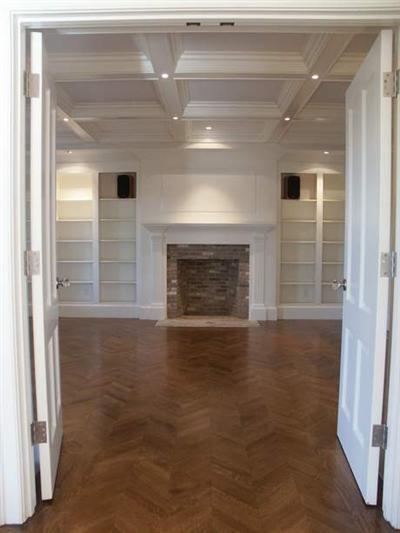 Undisclosed Address Barnstable, MA 02630 - Photo 8 of 13 a view of empty room with wooden floor and fireplace