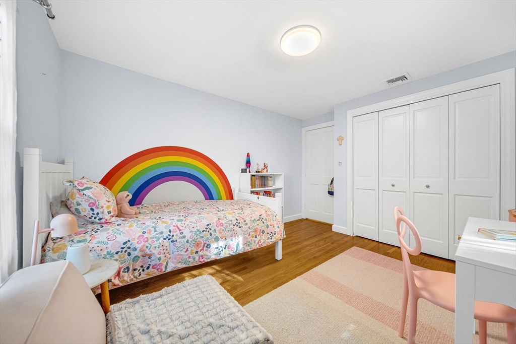 69 Donizetti Street Wellesley, MA 02482 - Photo 19 of 29 a bedroom with a bed and dresser