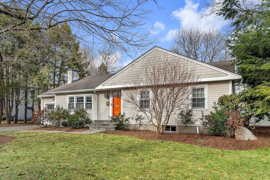 69 Donizetti Street Wellesley, MA 02482 - Photo 2 of 29 a front view of house with yard and green space