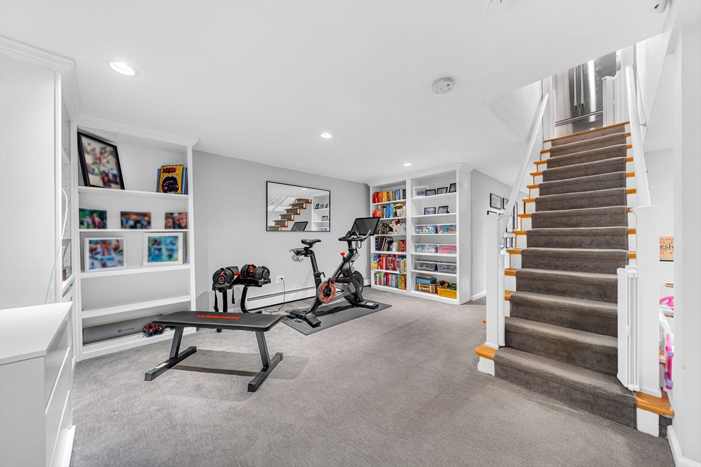 69 Donizetti Street Wellesley, MA 02482 - Photo 21 of 29 a view of a livingroom with furniture and staircase