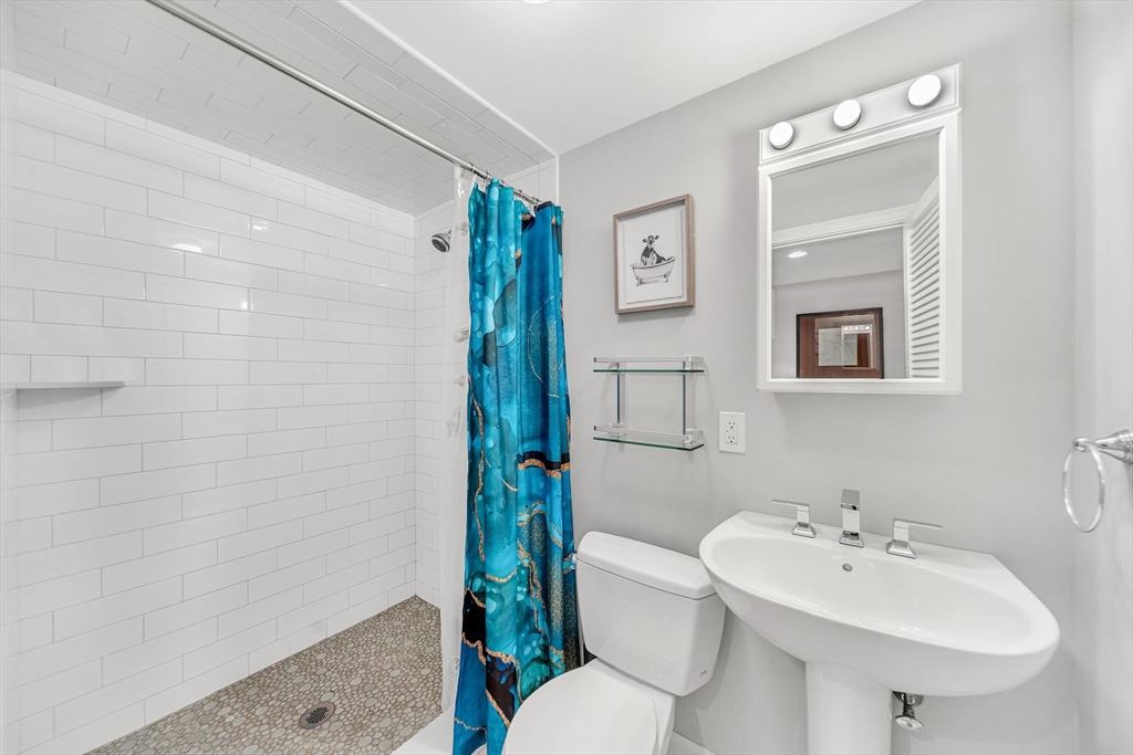 69 Donizetti Street Wellesley, MA 02482 - Photo 24 of 29 a bathroom with a sink toilet and shower