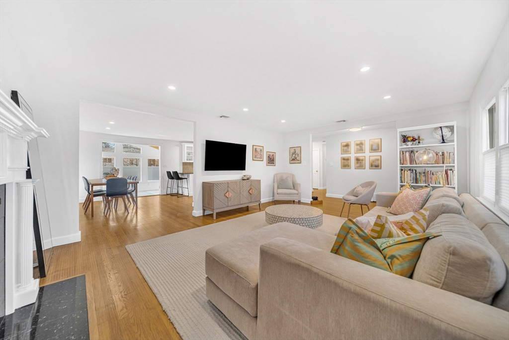 69 Donizetti Street Wellesley, MA 02482 - Photo 6 of 29 a living room with furniture and a flat screen tv