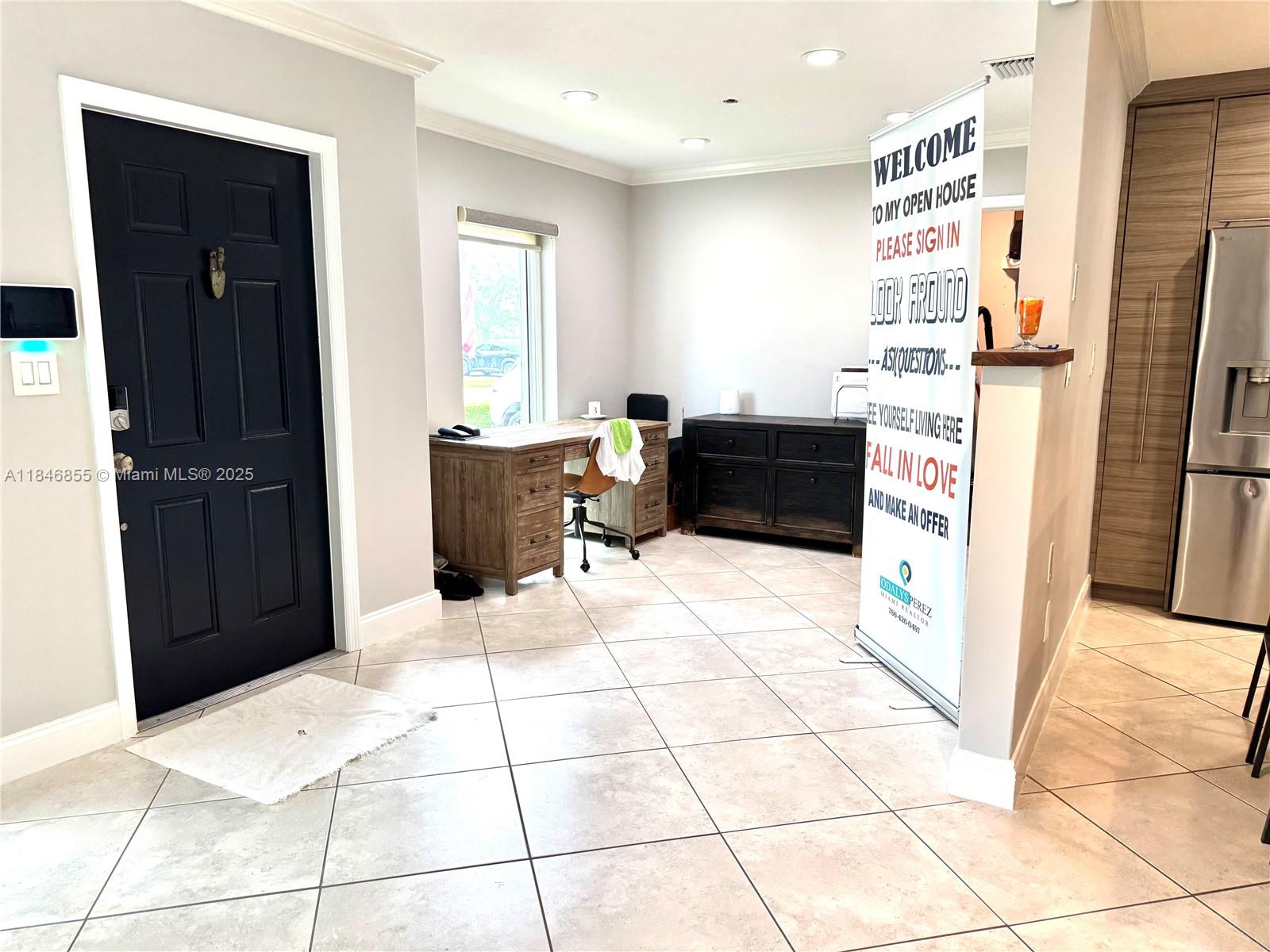 9385 Southwest 185th Street Cutler Bay, FL 33157 - Photo 11 of 27 a kitchen with stainless steel appliances kitchen island granite countertop a refrigerator and a counter top space
