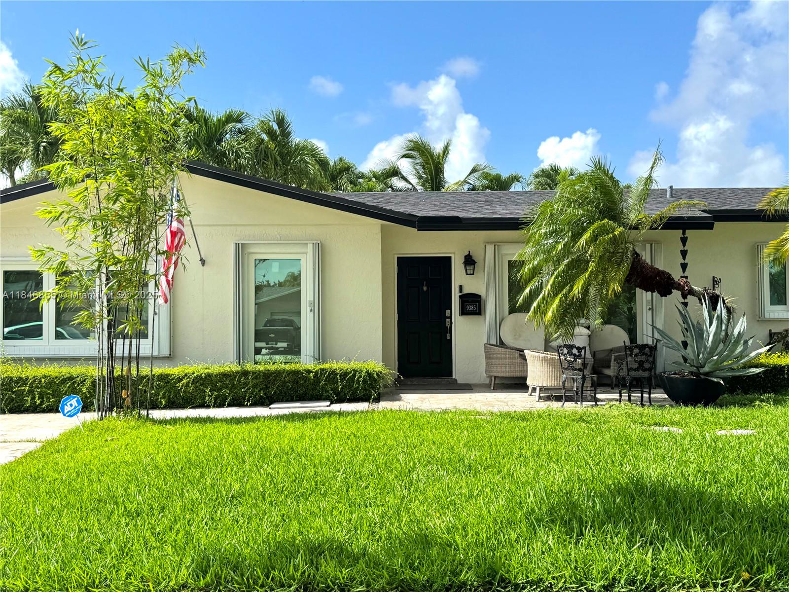 9385 Southwest 185th Street Cutler Bay, FL 33157 - Photo 2 of 27 a view of a house with a yard and sitting area