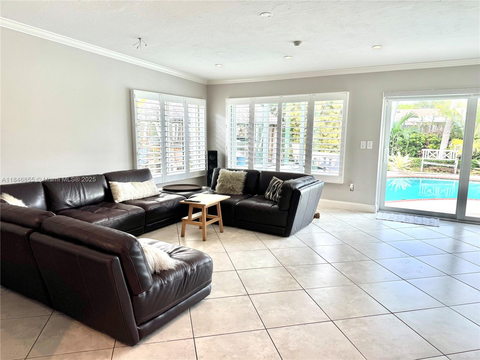9385 Southwest 185th Street Cutler Bay, FL 33157 - Photo 26 of 27 a living room with furniture and a large window
