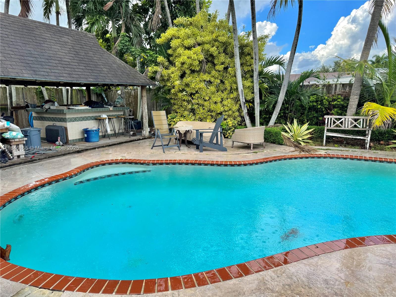9385 Southwest 185th Street Cutler Bay, FL 33157 - Photo 6 of 27 a view of swimming pool with outdoor seating