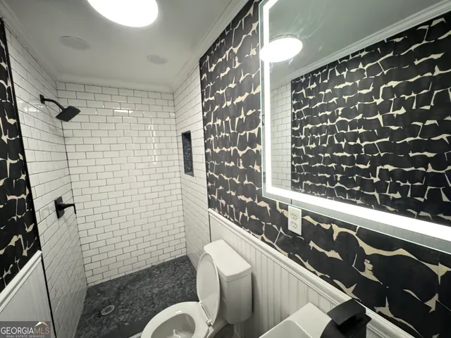 a bathroom with a bathtub and shower