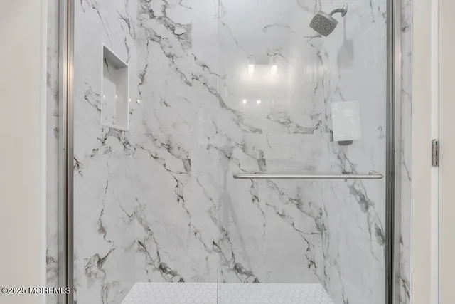 a kitchen with kitchen island a sink stainless steel appliances and cabinets