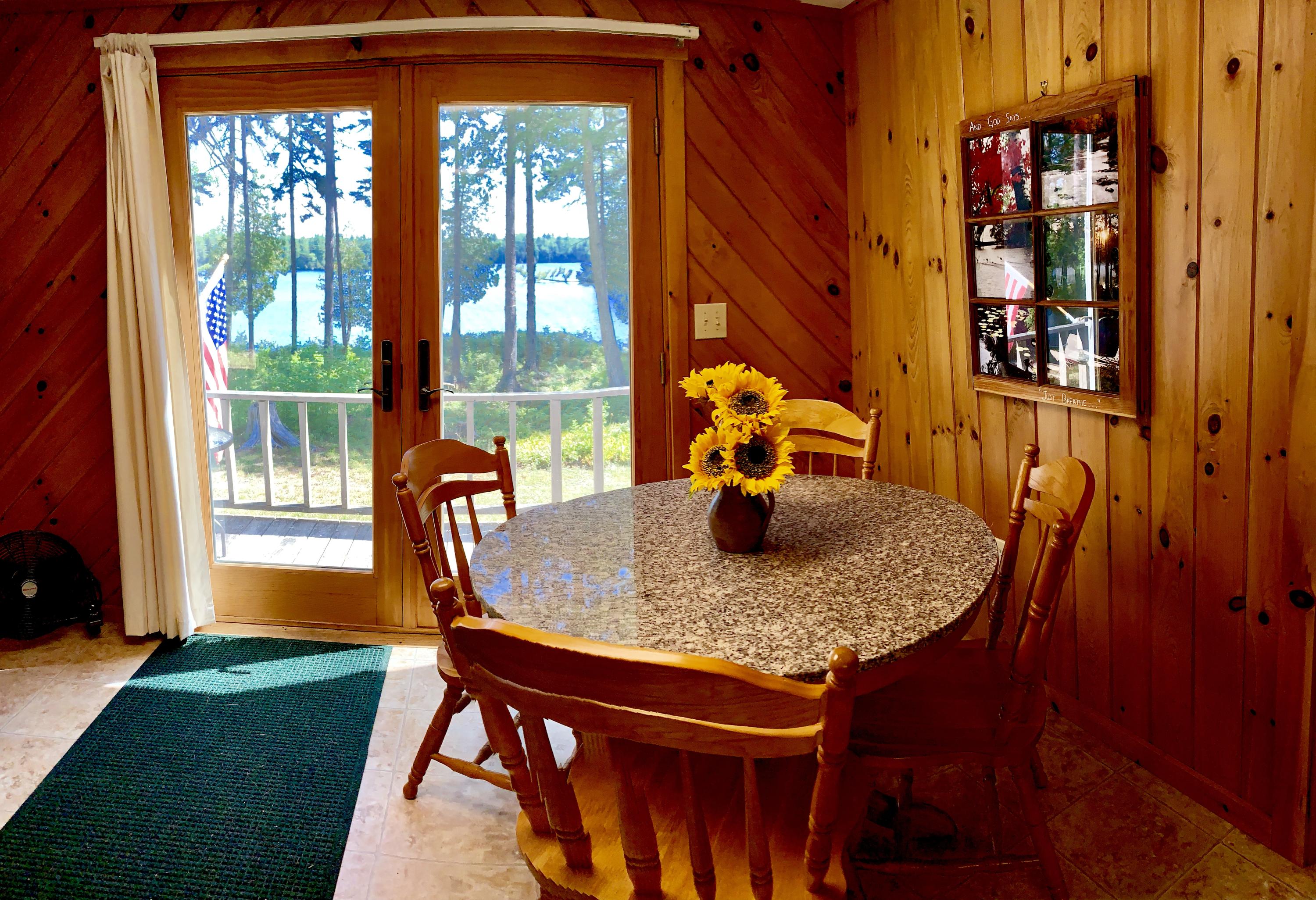 277 Shore Rd Lake View North Milo, ME 04463 - Photo 16 of 59 Dining Area with Patio Doors to the Deck
