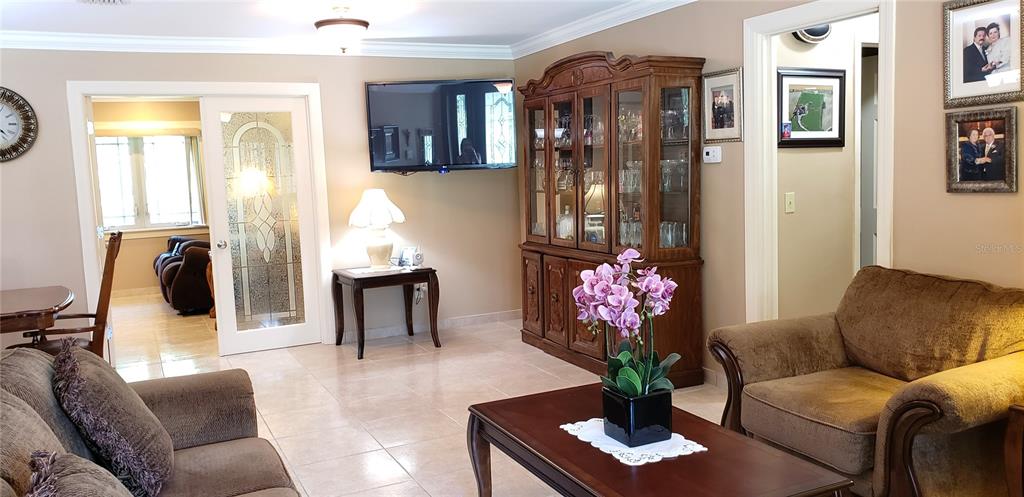 514 Brandon Avenue Clearwater, FL 33765 - Photo 13 of 67 a living room with furniture and flowers