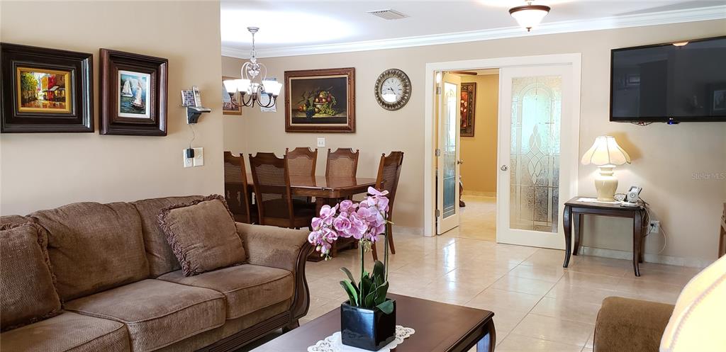 514 Brandon Avenue Clearwater, FL 33765 - Photo 4 of 67 a living room with furniture flowerpot and window