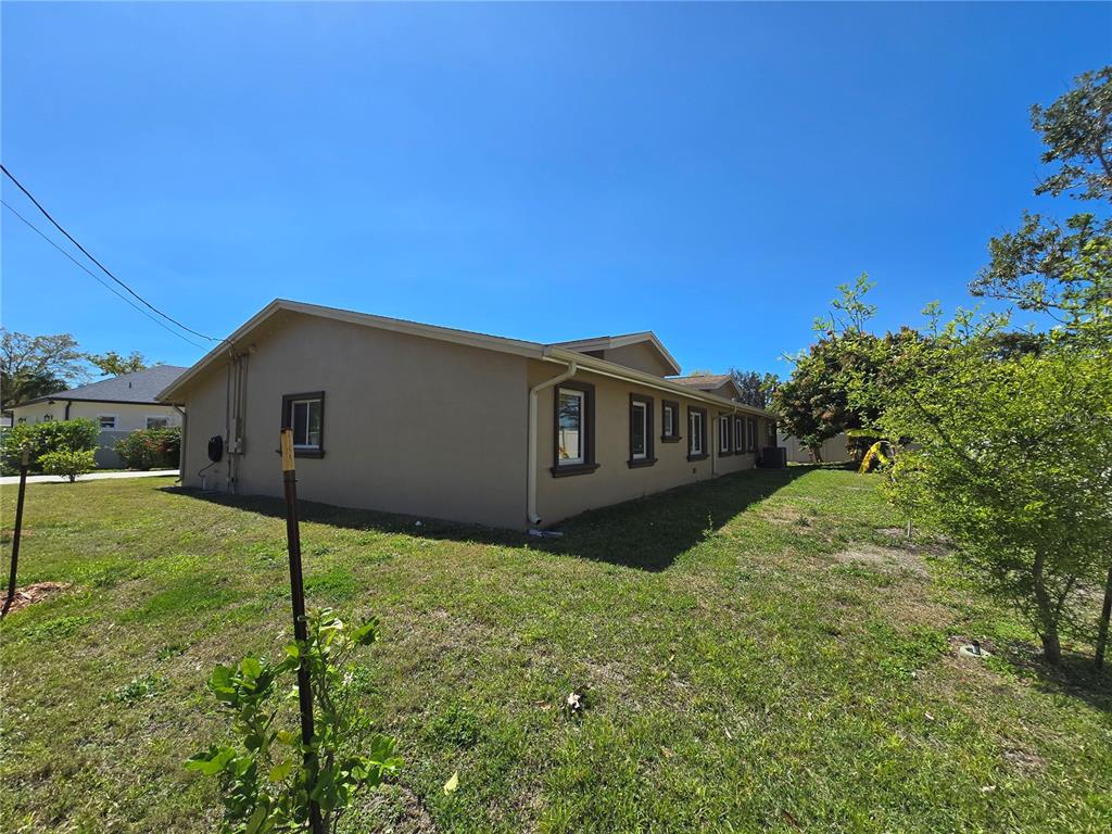 514 Brandon Avenue Clearwater, FL 33765 - Photo 42 of 67 a front view of a house with a yard