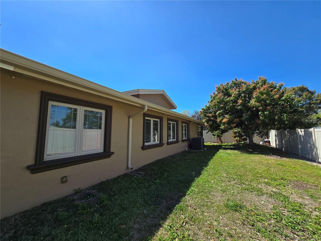 514 Brandon Avenue Clearwater, FL 33765 - Photo 43 of 67 a backyard of a house with large trees