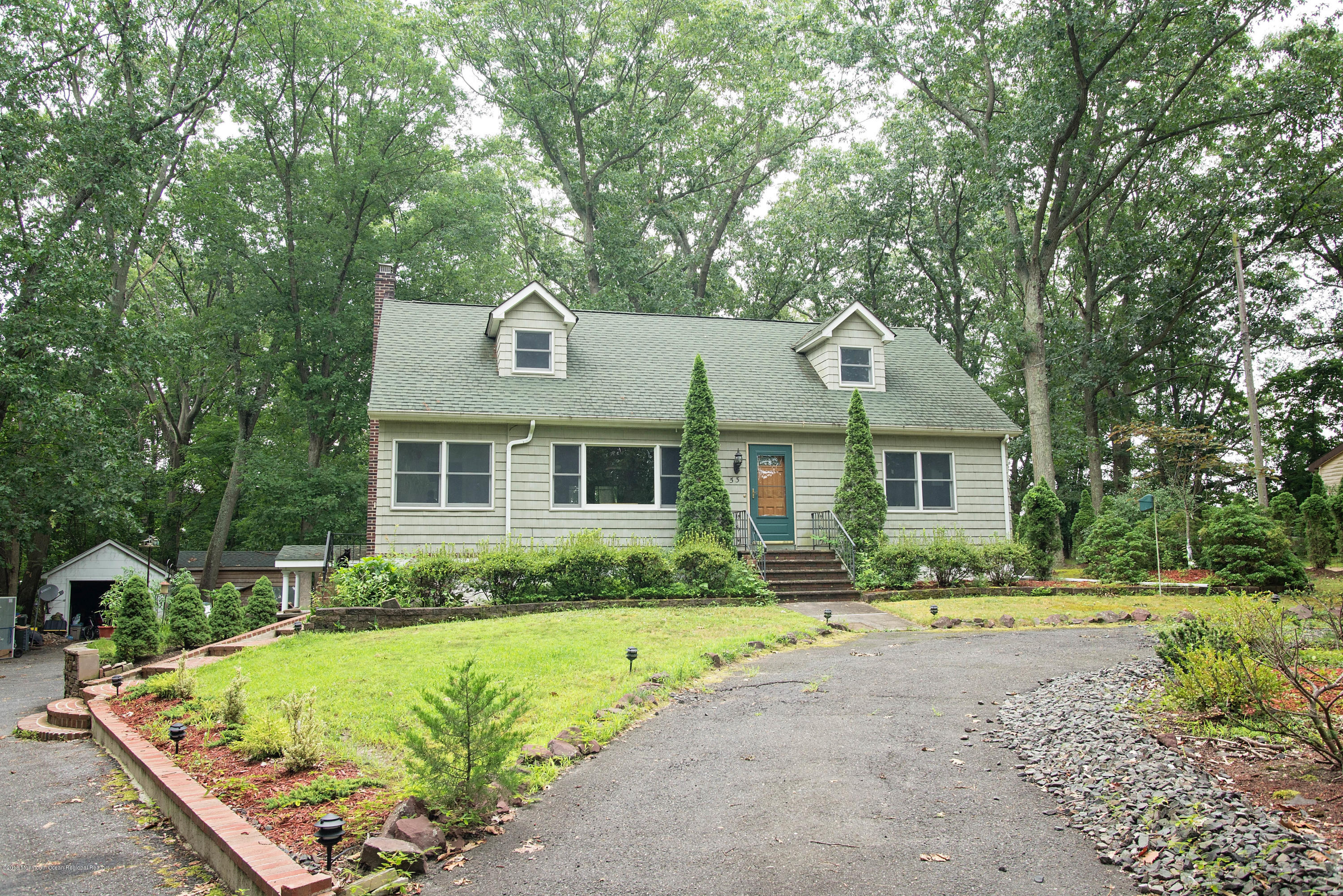 53 Fort Plains Road Howell, NJ 07731 - Photo 1 of 19 a front view of a house with a yard