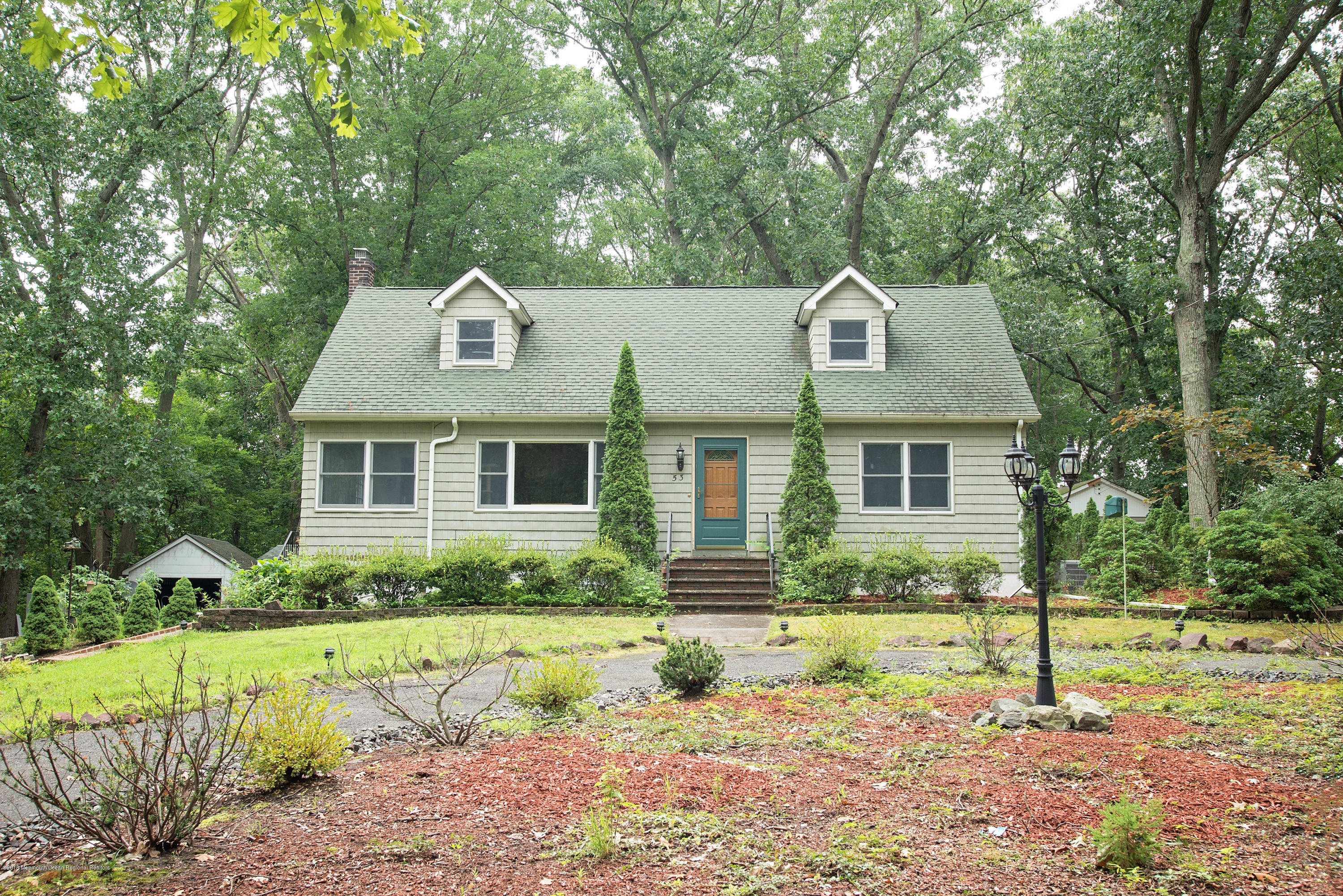 53 Fort Plains Road Howell, NJ 07731 - Photo 2 of 19 a front view of a house with a yard