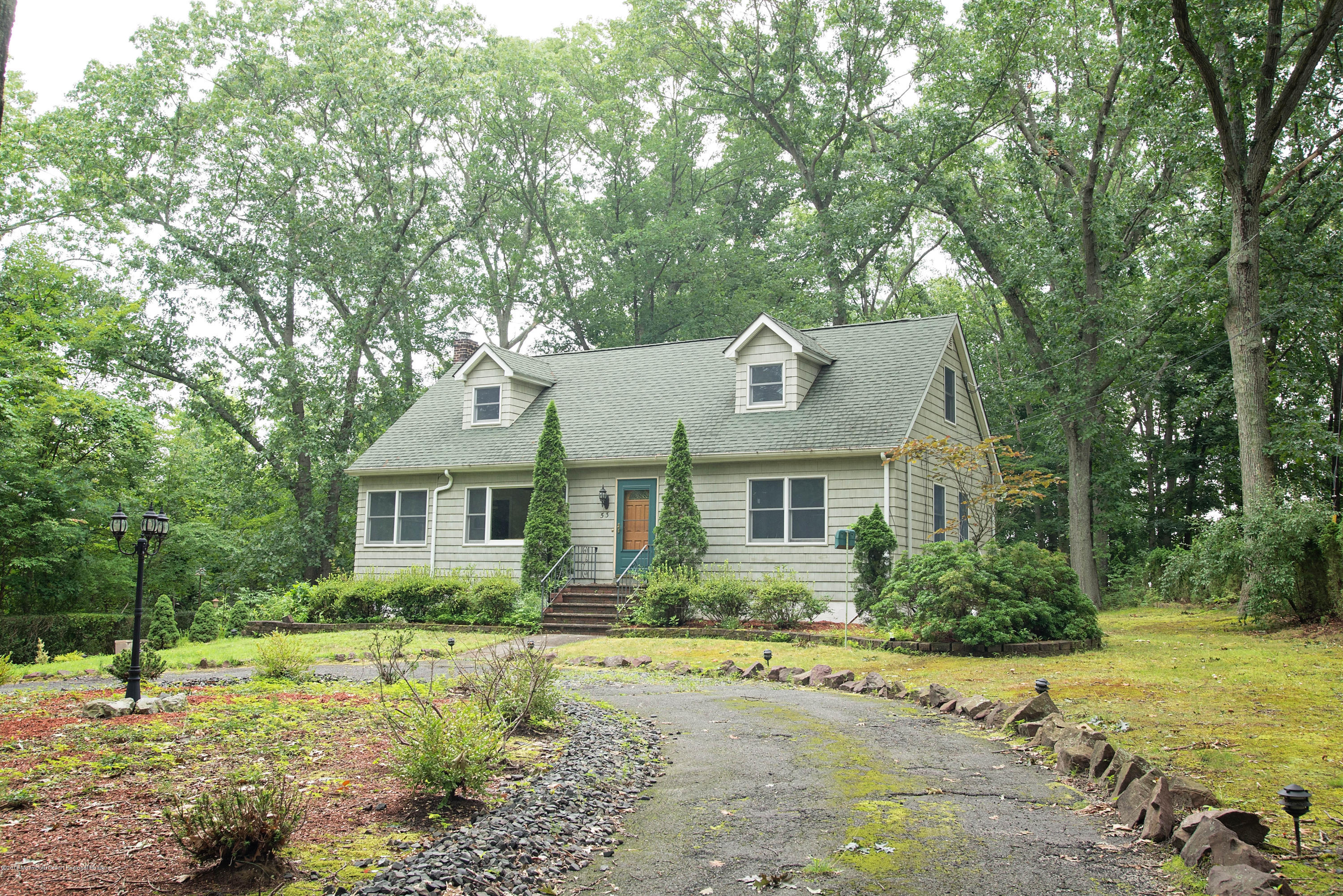 53 Fort Plains Road Howell, NJ 07731 - Photo 3 of 19 a front view of a house with a yard