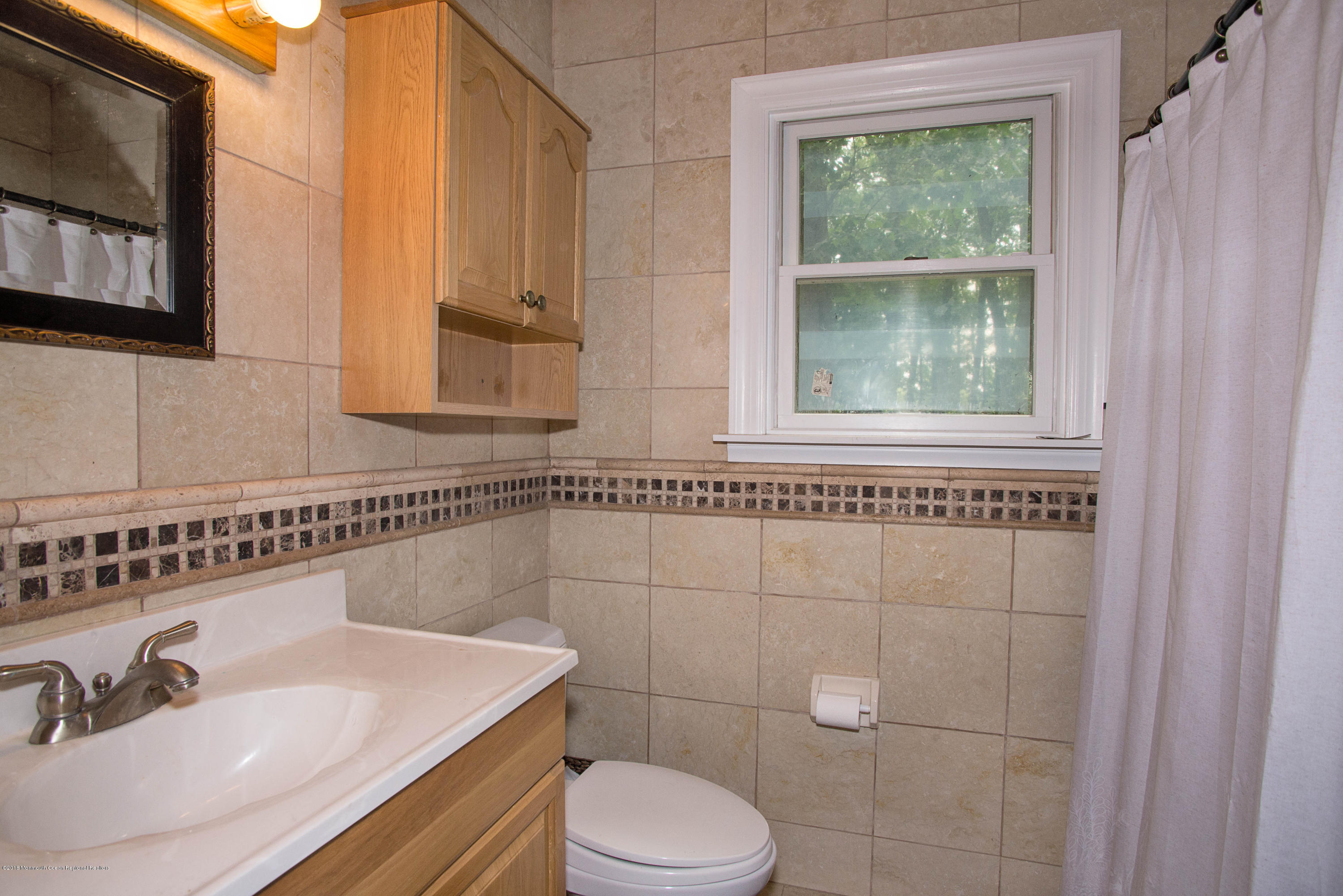 53 Fort Plains Road Howell, NJ 07731 - Photo 10 of 19 a bathroom with a sink a toilet and a mirror