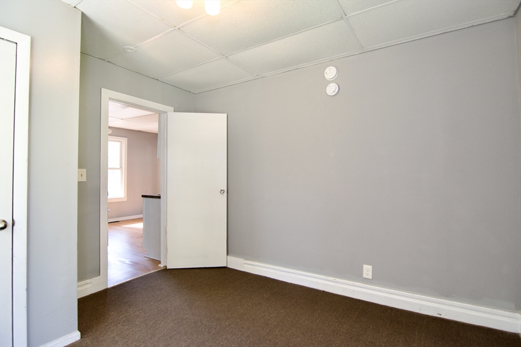425 Taylor Street, Unit 1 Springfield, MA 01105 - Photo 24 of 25 an empty room with a empty space and windows