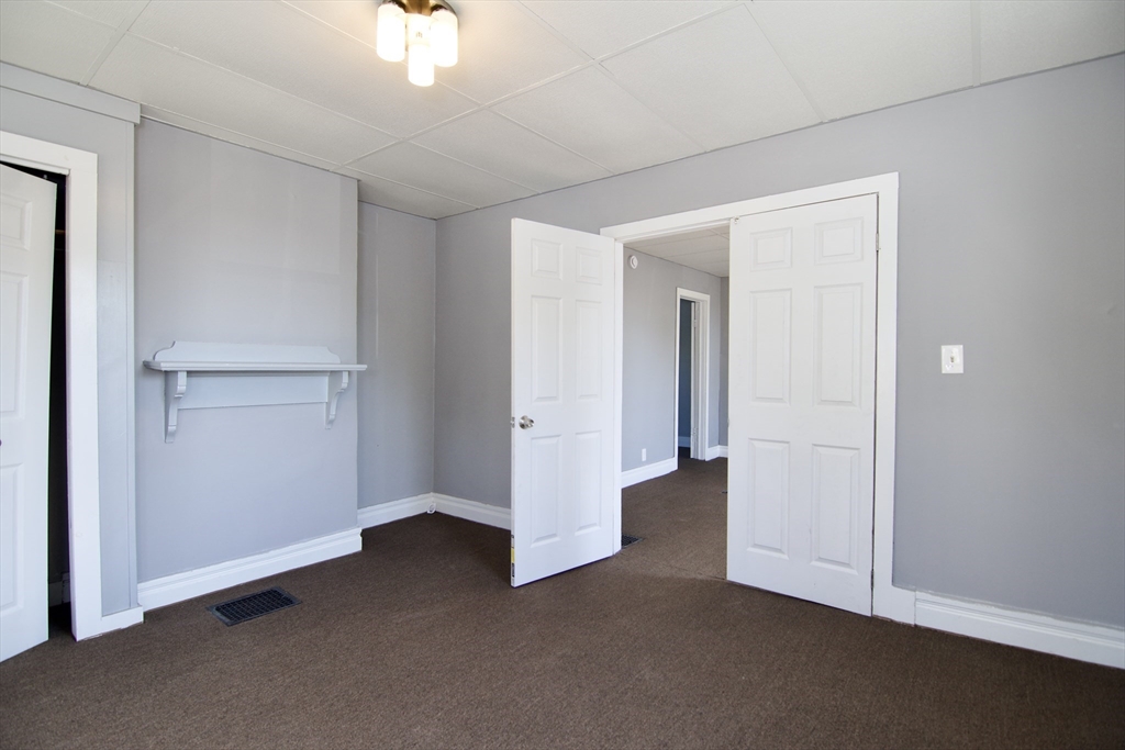 425 Taylor Street, Unit 1 Springfield, MA 01105 - Photo 6 of 25 a view of an empty room and chandelier fan
