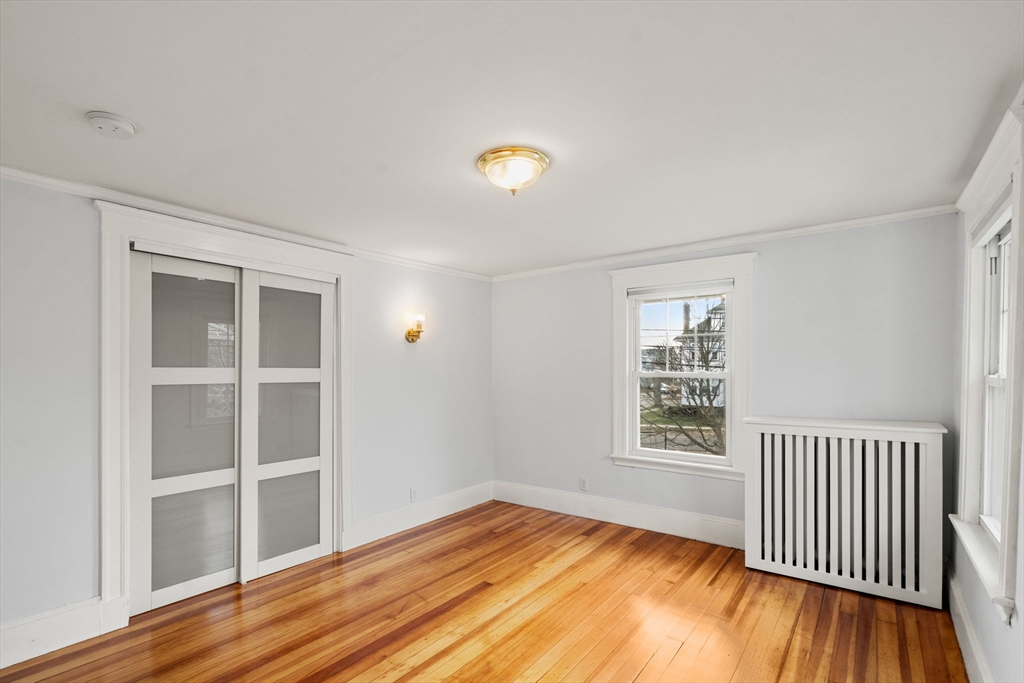 312 Edge Hill Road Milton, MA 02186 - Photo 19 of 34 wooden floor in an empty room with a window