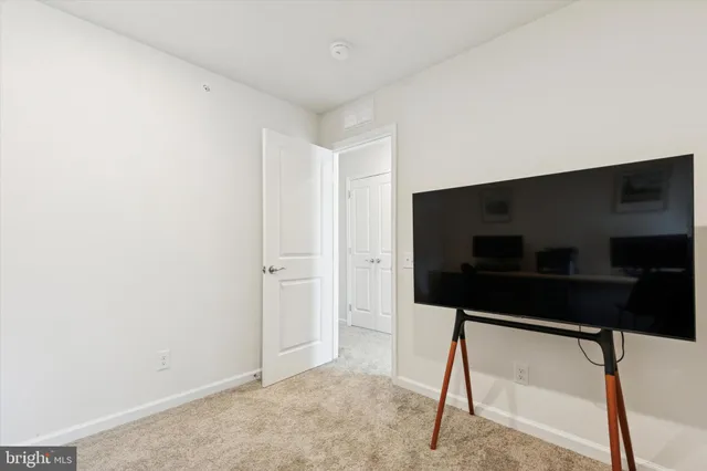 a hallway with table and chair