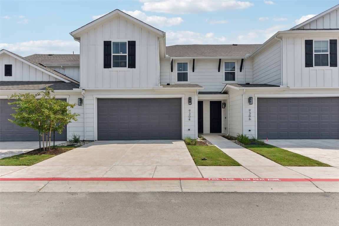 a house with yard and a large parking space