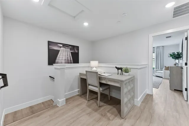 a bathroom with a granite countertop sink mirror and toilet