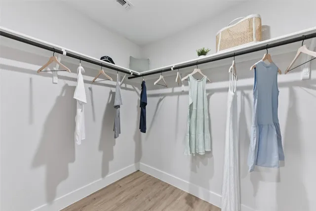 a bathroom with double vanity sinks and a mirror