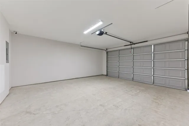 a view of walk in closet with wooden floor