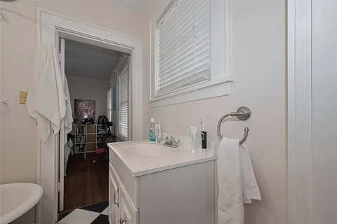 a bathroom with a sink and mirror