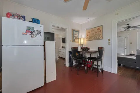 a view of a livingroom with furniture and a workspace