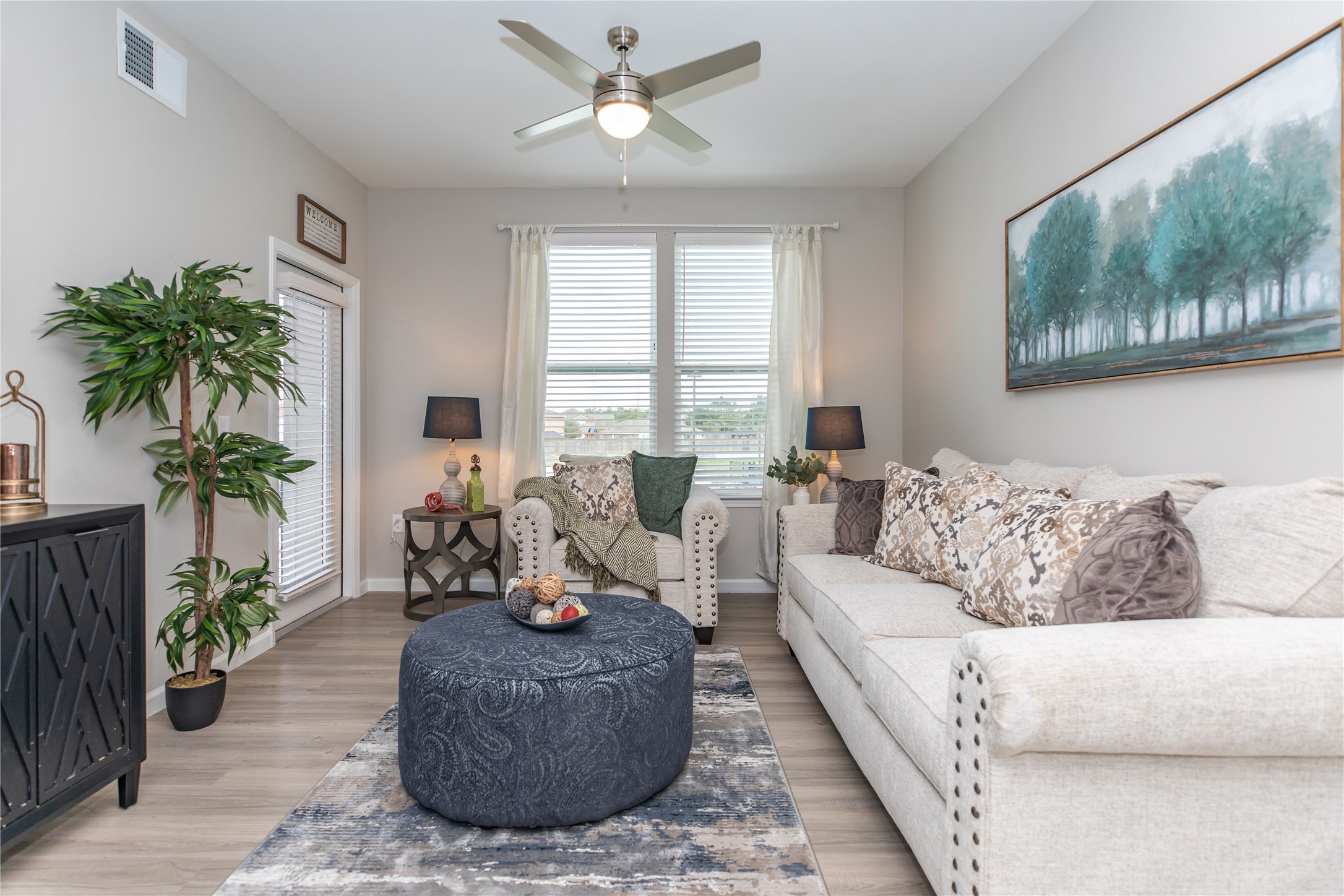 14809 Ralston Road, Unit A18302 Humble, TX 77396 - Photo 6 of 16 a living room with furniture and a large window
