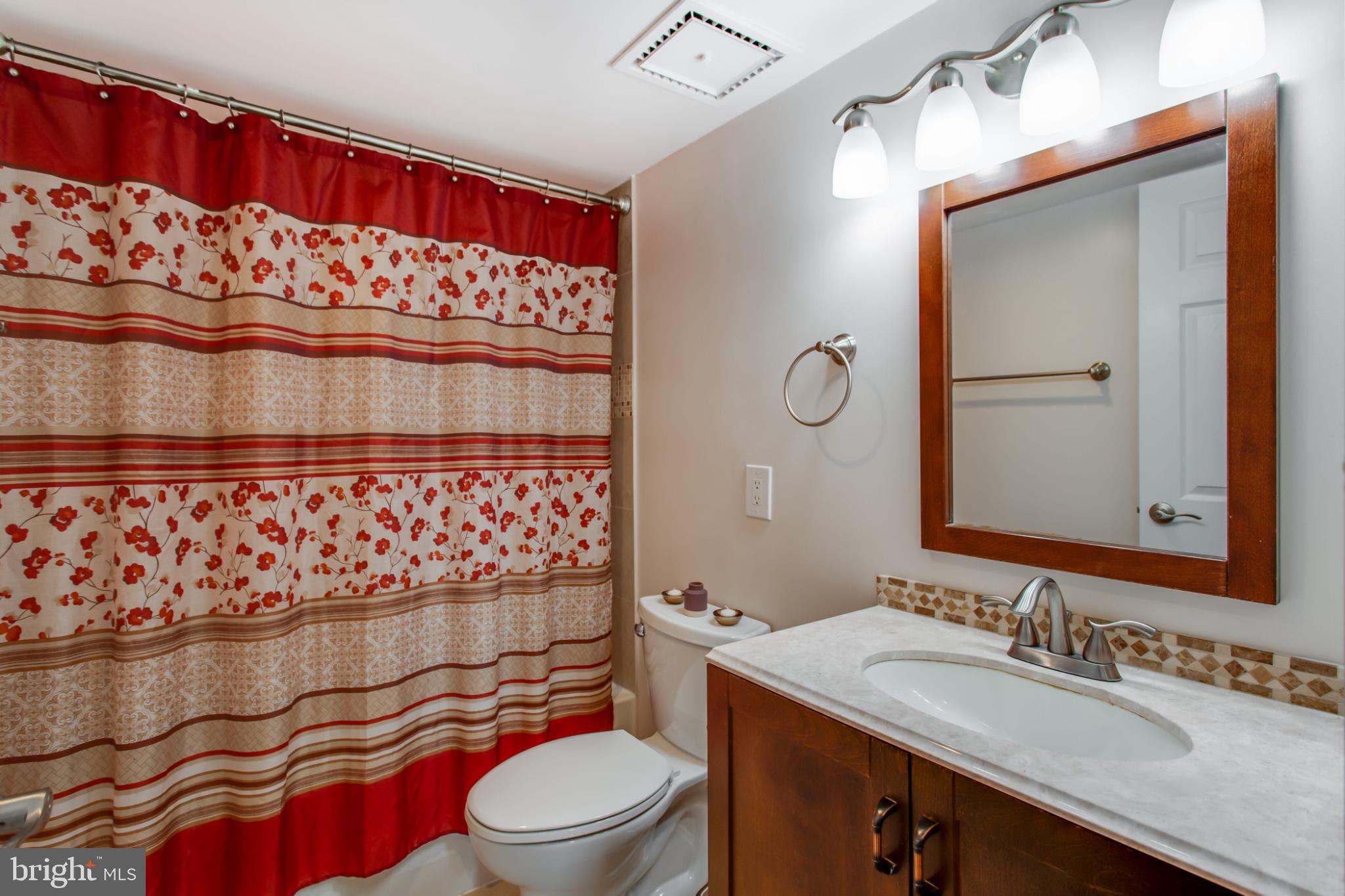 1808 Old Meadow Road, Unit 1012 McLean, VA 22102 - Photo 33 of 62 Charming bathroom with floral accents.