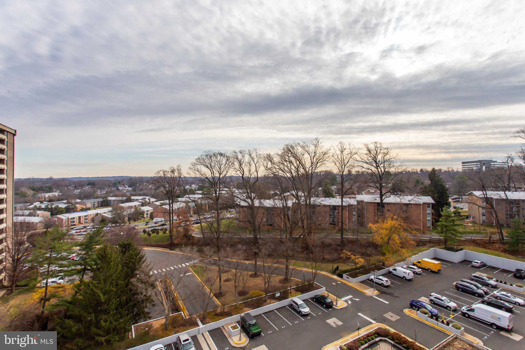 1808 Old Meadow Road, Unit 1012 McLean, VA 22102 - Photo 36 of 62 Serene urban landscape under cloudy skies.