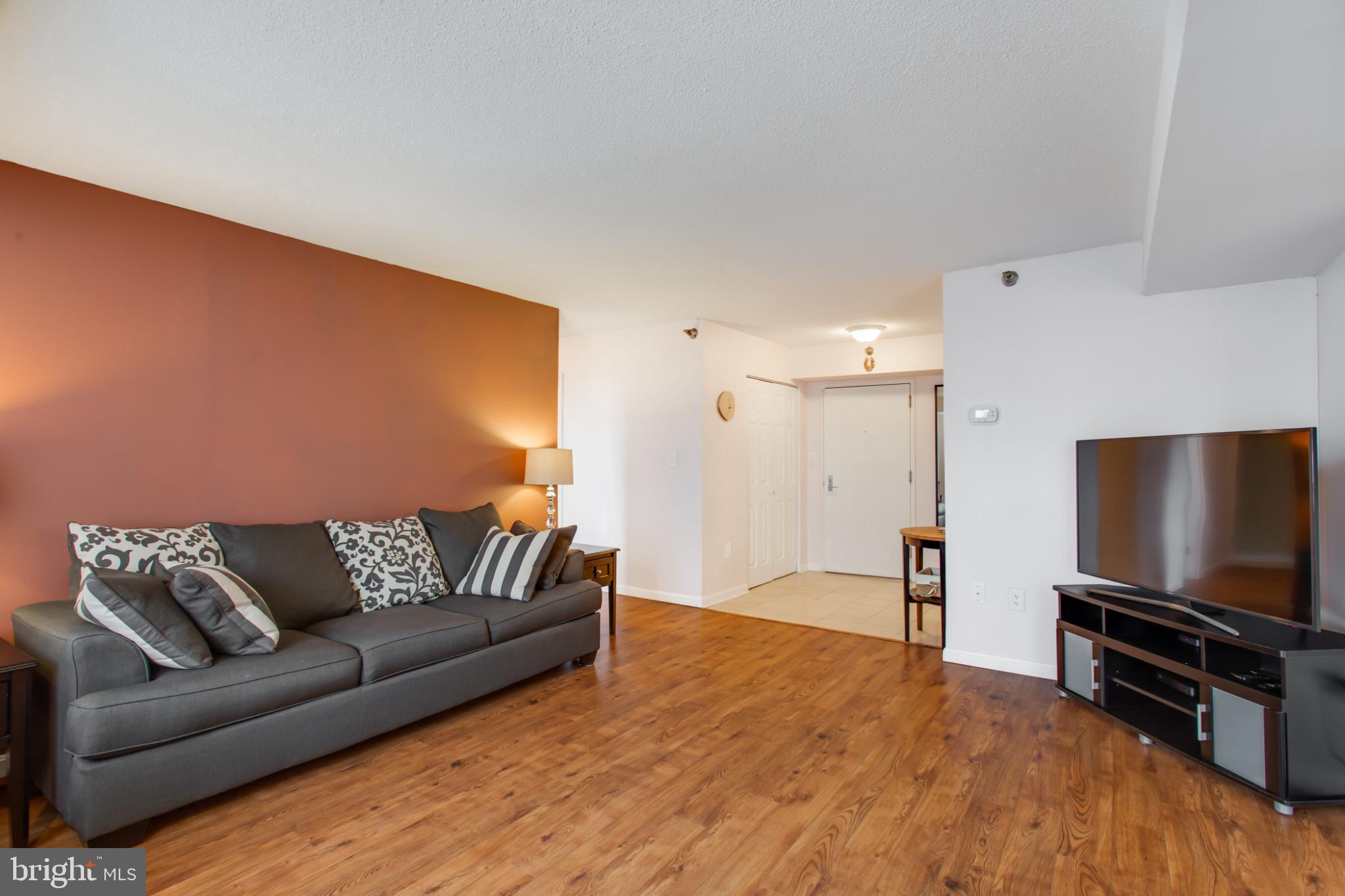 1808 Old Meadow Road, Unit 1012 McLean, VA 22102 - Photo 8 of 62 Modern living space with warm accents.