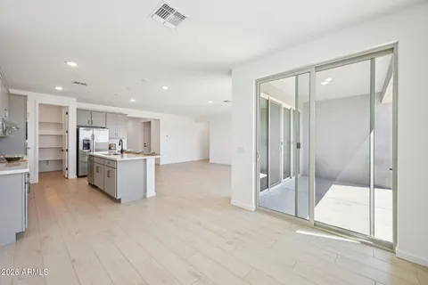 a kitchen with a sink and white cabinets