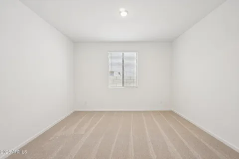 an empty room with a empty space and window