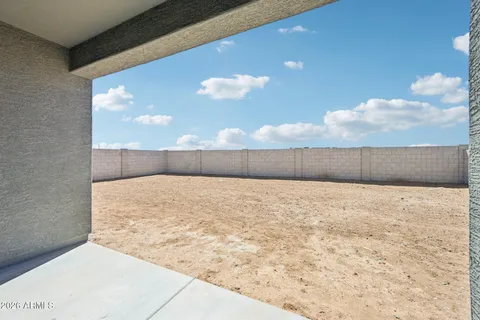 a view of empty room with wooden fence
