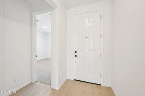 a view of a hallway with a white walls