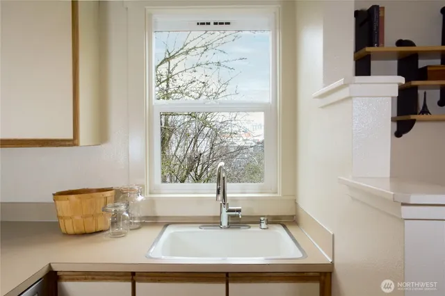 a kitchen with a sink and a window