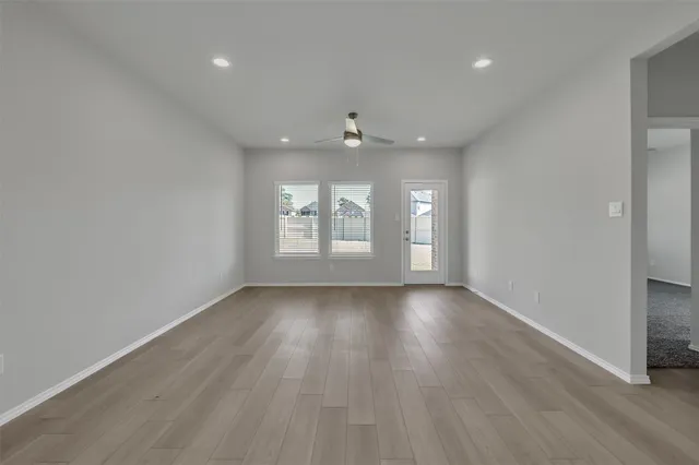a view of kitchen and refrigerator