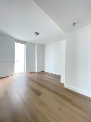 a bathroom with a granite countertop sink a toilet and bathtub