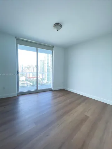 a bathroom with a shower and toilet