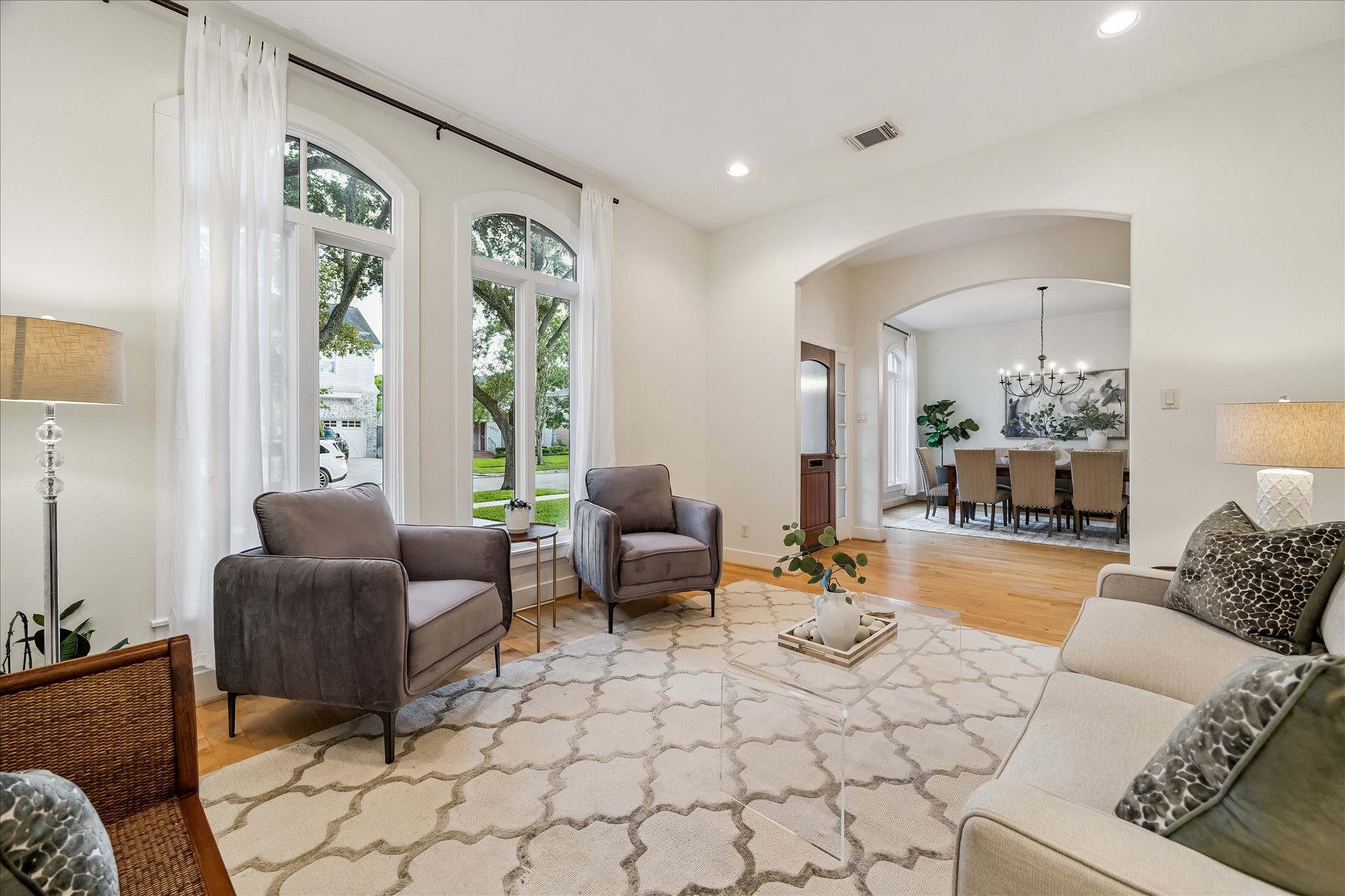 4010 Milton Street Houston, TX 77005 - Photo 5 of 49 Note the details. Arched windows frame garden views. Both front formals have pretty arched openings. Note the home has double pane windows.