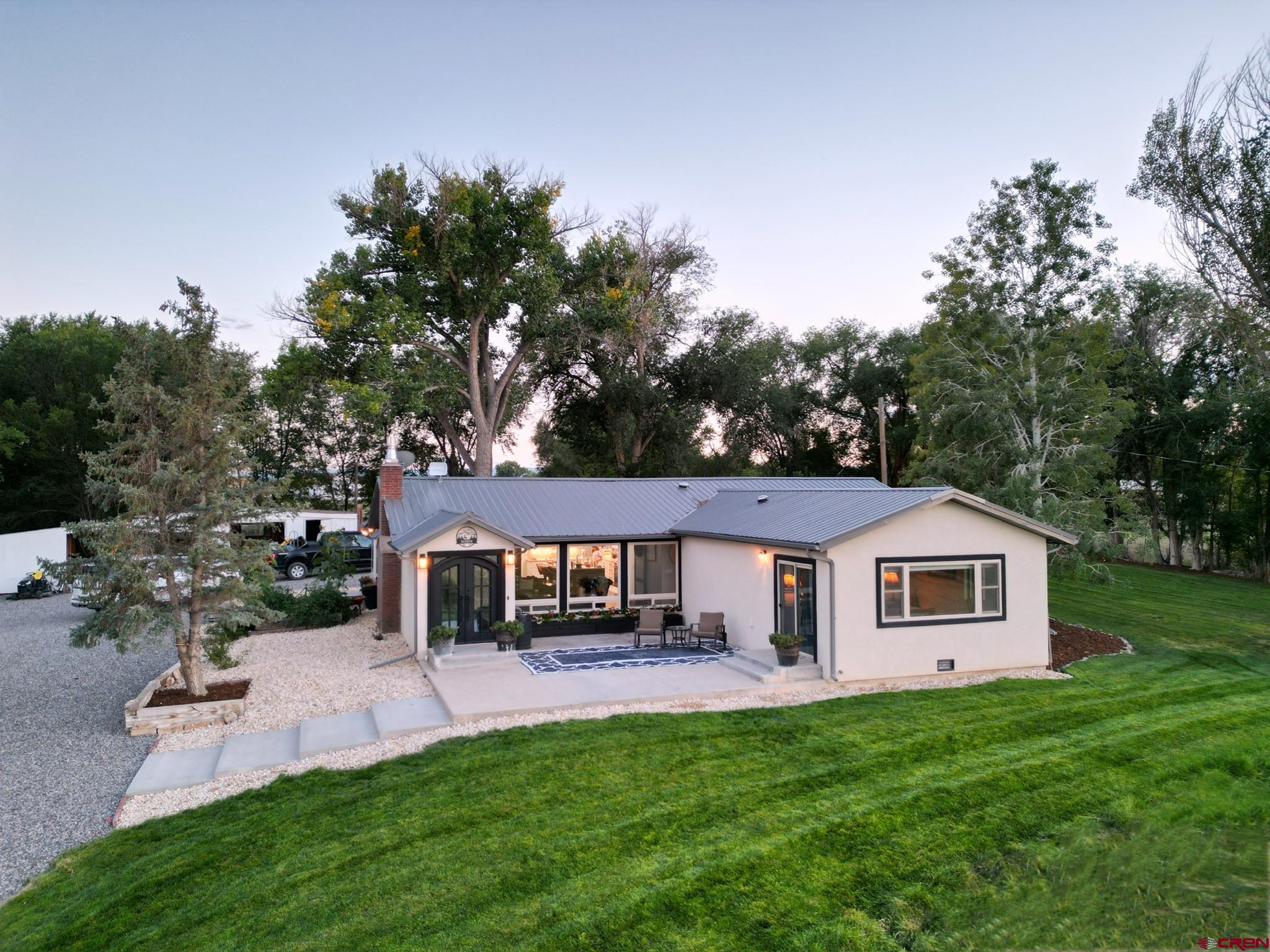 14332 G Road Delta, CO 81416 - Photo 1 of 35 a front view of a house with a garden