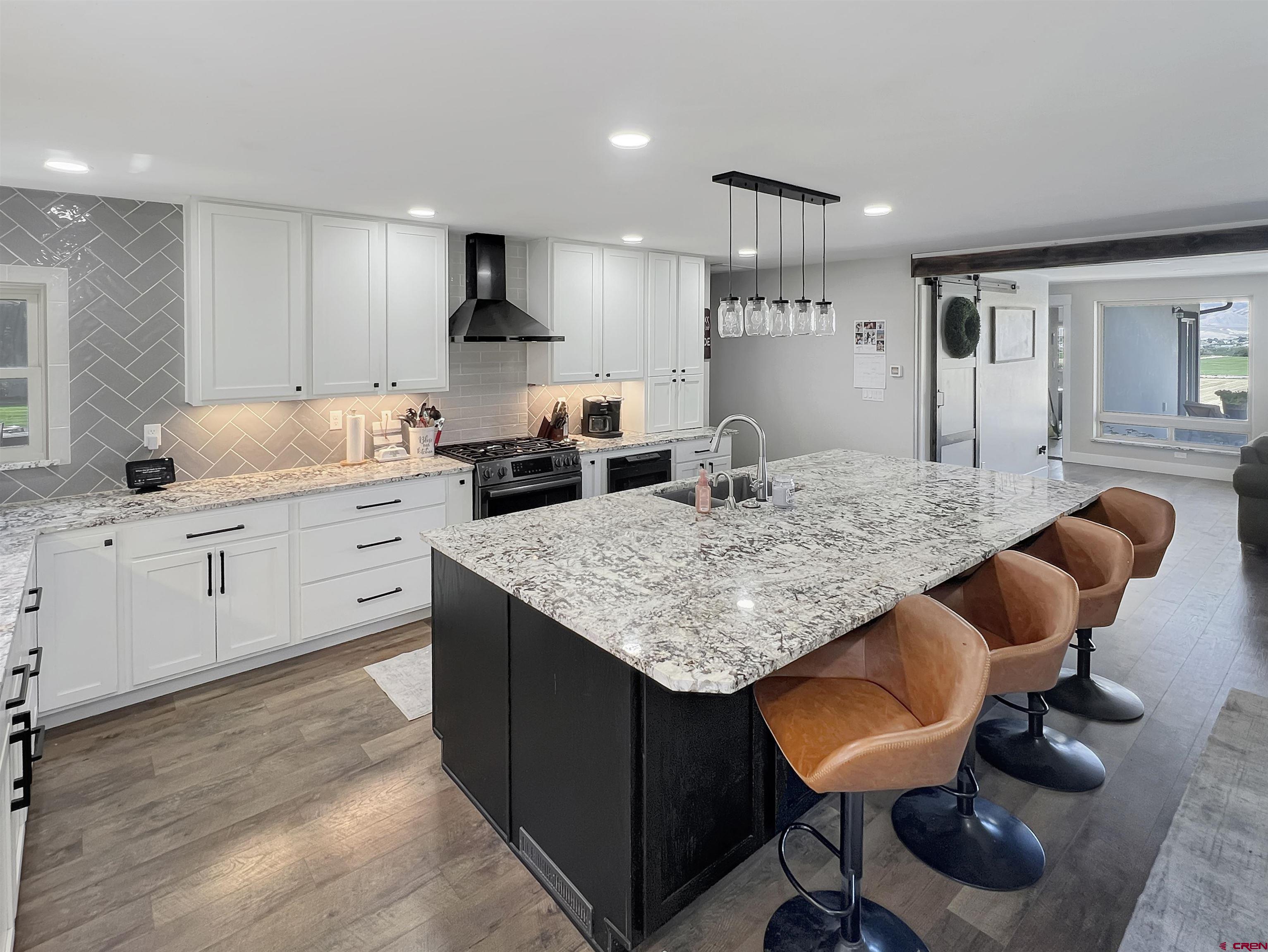 14332 G Road Delta, CO 81416 - Photo 14 of 35 a kitchen with sink and chairs